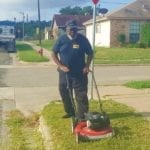 Bus Driver Mows Tall Grass and Weeds at Bus Stop for Local Children