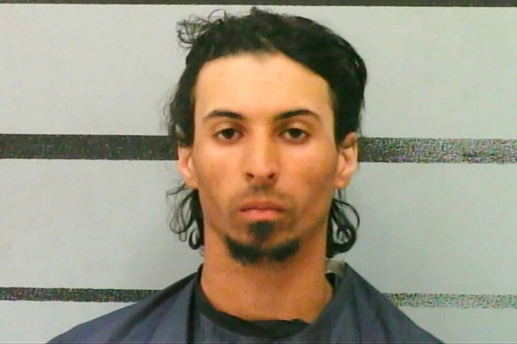 a texas man has been charged with murder after he stuffed his girlfriend's baby in a backpack | trevor rowe, 27, was arrested by the lubbock police department last week and is currently being held on capital murder charges and $2 million bond.