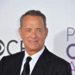 Actor Tom Hanks Plays His Best Role, Dotting Dad and Husband, While Accepting Prominent Golden Globe Award