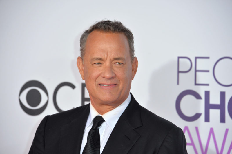 Actor Tom Hanks Plays His Best Role, Dotting Dad and Husband, While Accepting Prominent Golden Globe Award