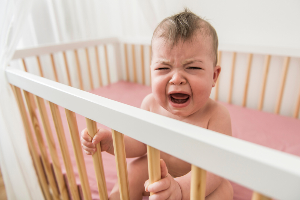 my 9-month-old baby wakes up multiple times a night in tears: is this normal?