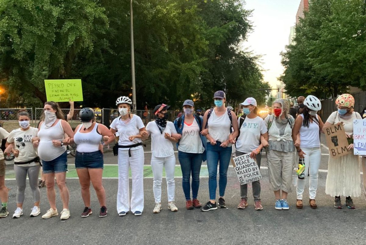 A Group of Moms in Oregon Took to the Streets to Form a Wall of Moms Around Peaceful Protesters Being Singled Out Federal Police Officers