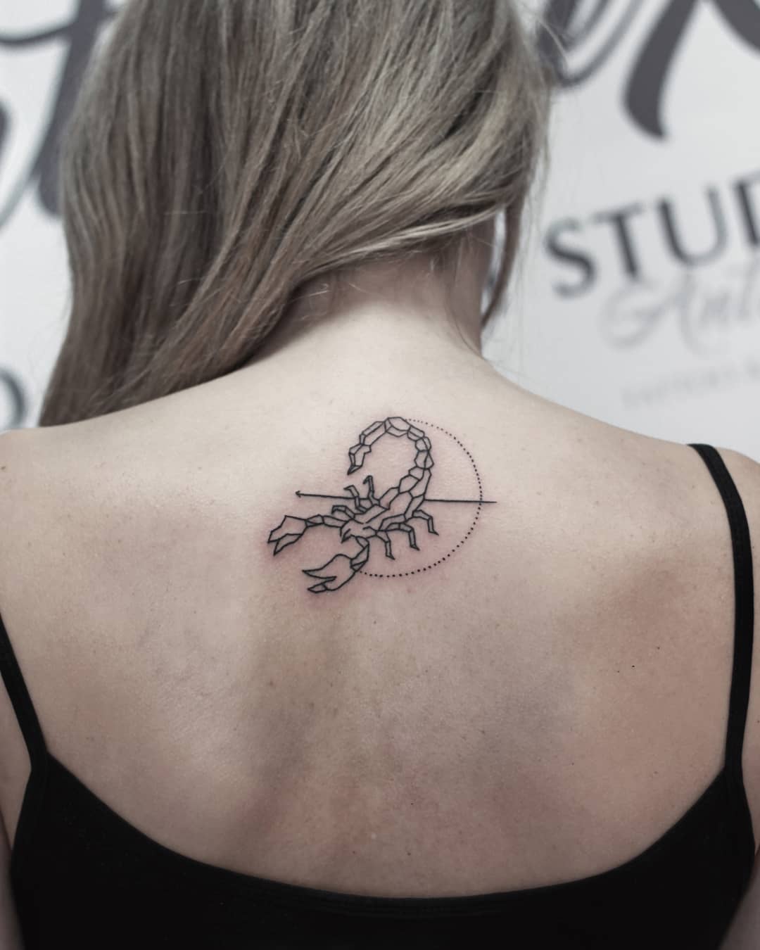 25 stinging scorpio tattoos that are heavy on mystery and mood
