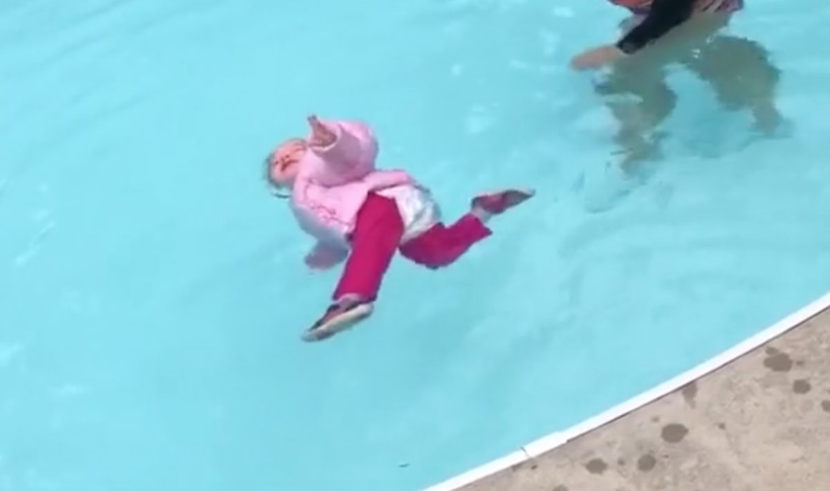 controversial tiktok showing a swim teacher letting a fully clothed toddler fall in the pool as a lesson goes viral