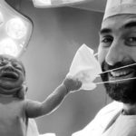 Viral Photo of Newborn Pulling Doctor's Mask Off Is 2020 in a Nutshell