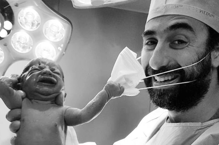 Viral Photo of Newborn Pulling Doctor's Mask Off Is 2020 in a Nutshell