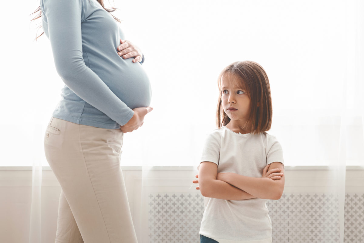 help! i am worried about how my daughter, who doesn't want a sibling, will react to finding out i am pregnant: advice? 