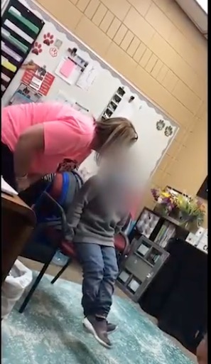 elementary school principal caught on camera paddling 6-year-old student