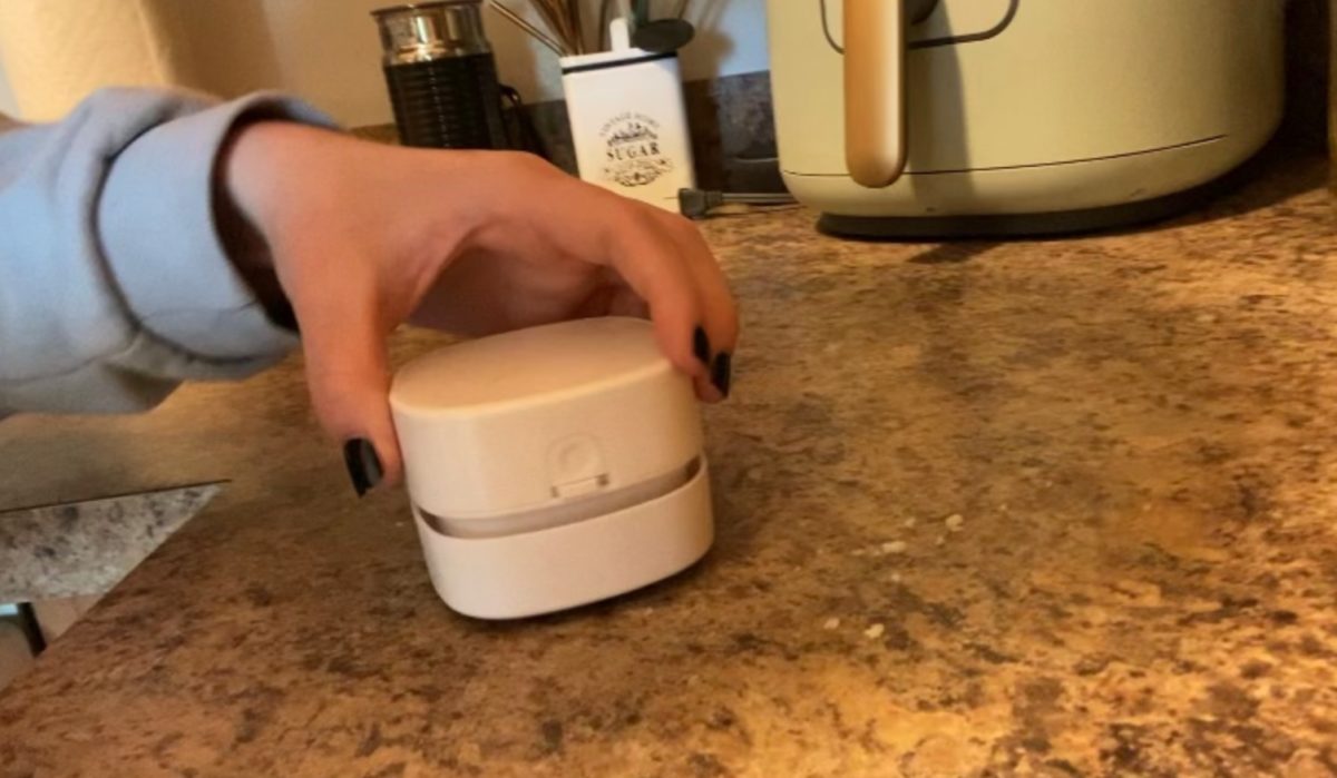 this mini vacuum that costs just $12 is exactly what your car and kitchen counters need