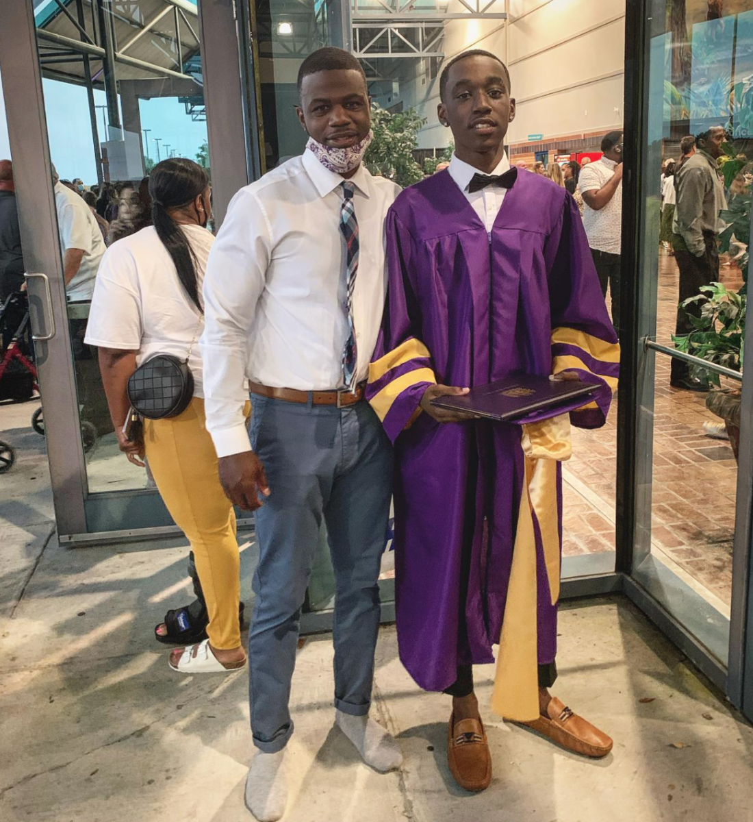 Teacher Steps In After High School Senior Told He Can't Walk At High School Graduation With Sneakers