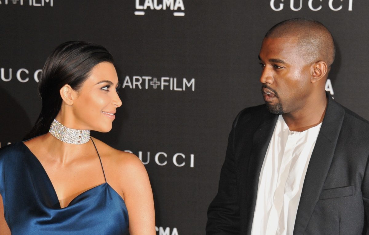kim kardashian and kanye west 'are not calling the divorce off' despite sharing the stage for donda