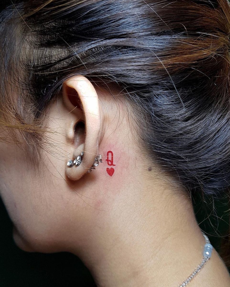 25 banging behind ear tattoos
