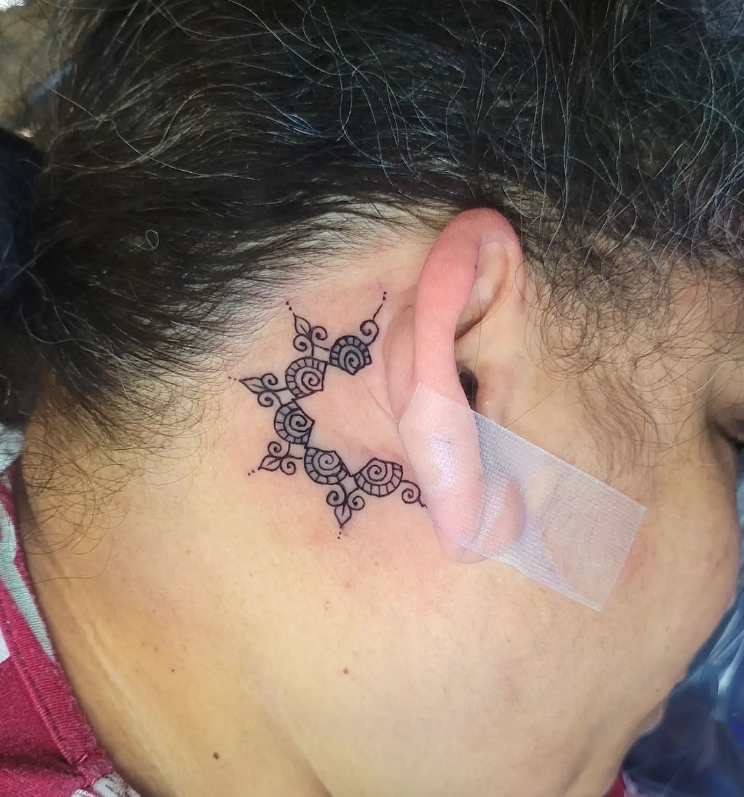 25 banging behind ear tattoos