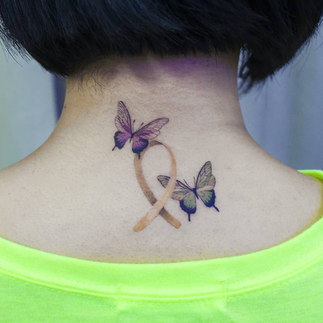 2 butterfly tattoo on back of neck