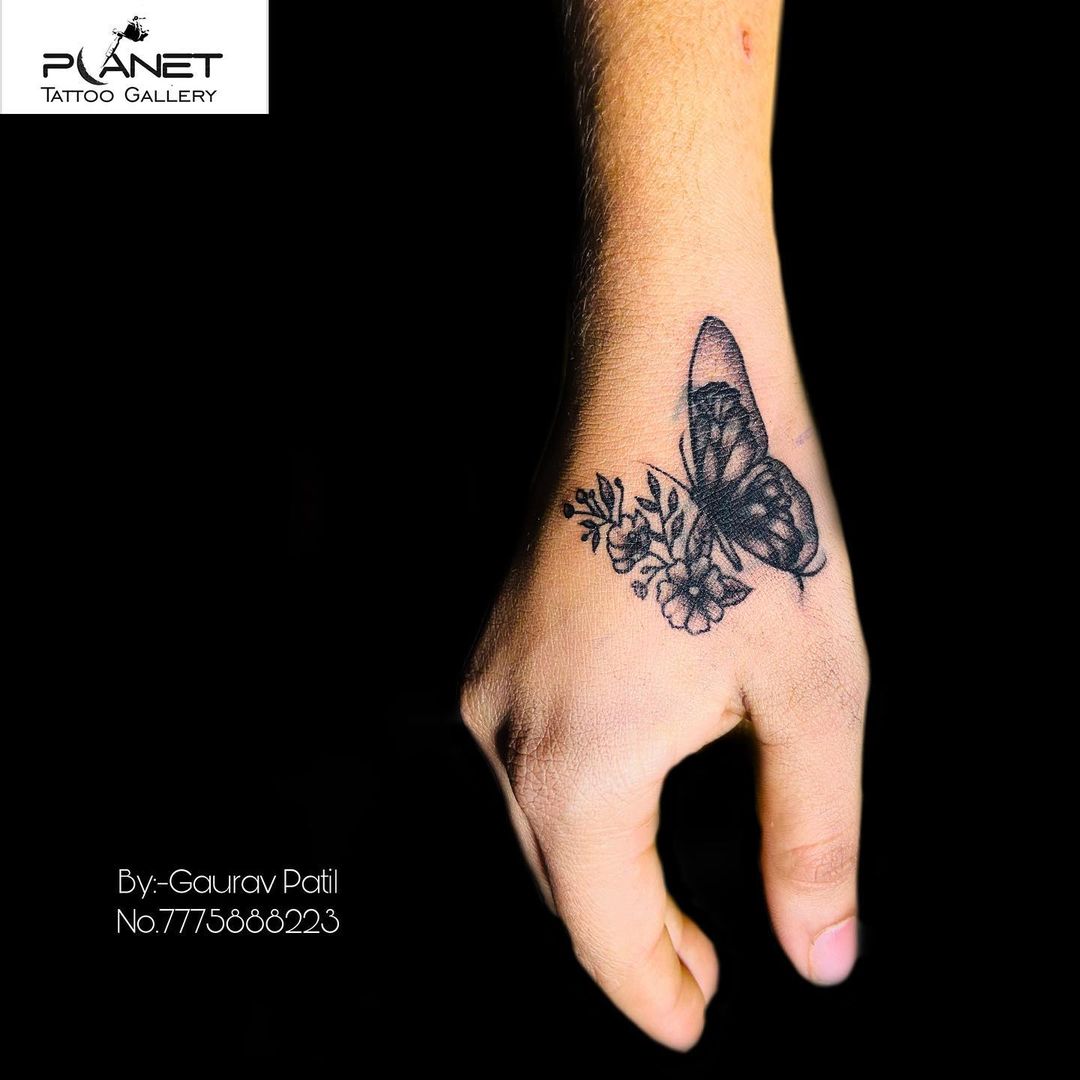 55 butterfly hand tattoo
