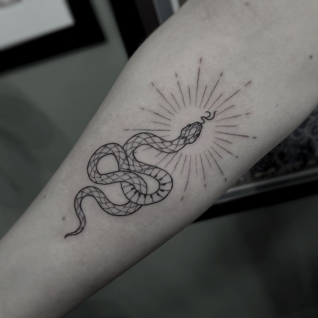 Stunning Snake Tattoo Ideas For Those Who Like the Slither | From garden variety to anaconda pythons, we've rounded up the best snake tattoo ideas.