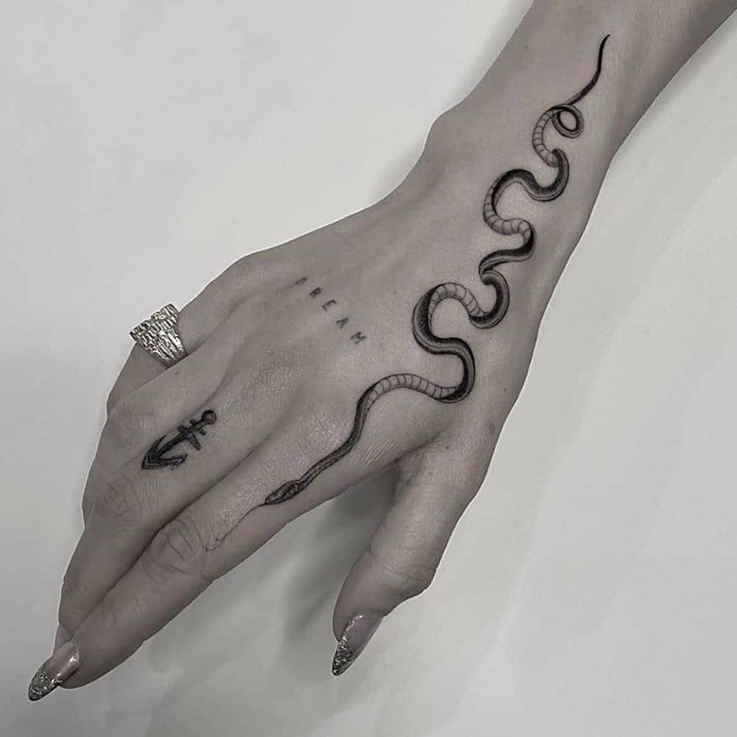 Stunning Snake Tattoo Ideas For Those Who Like the Slither | From garden variety to anaconda pythons, we've rounded up the best snake tattoo ideas.