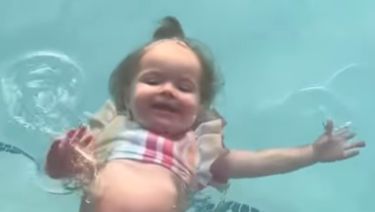 lindsay arnold shares clips of 14-month-old daughter swimming by herself