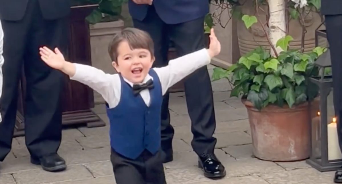 there is no better reaction than this little boy seeing his mom walk down the aisle