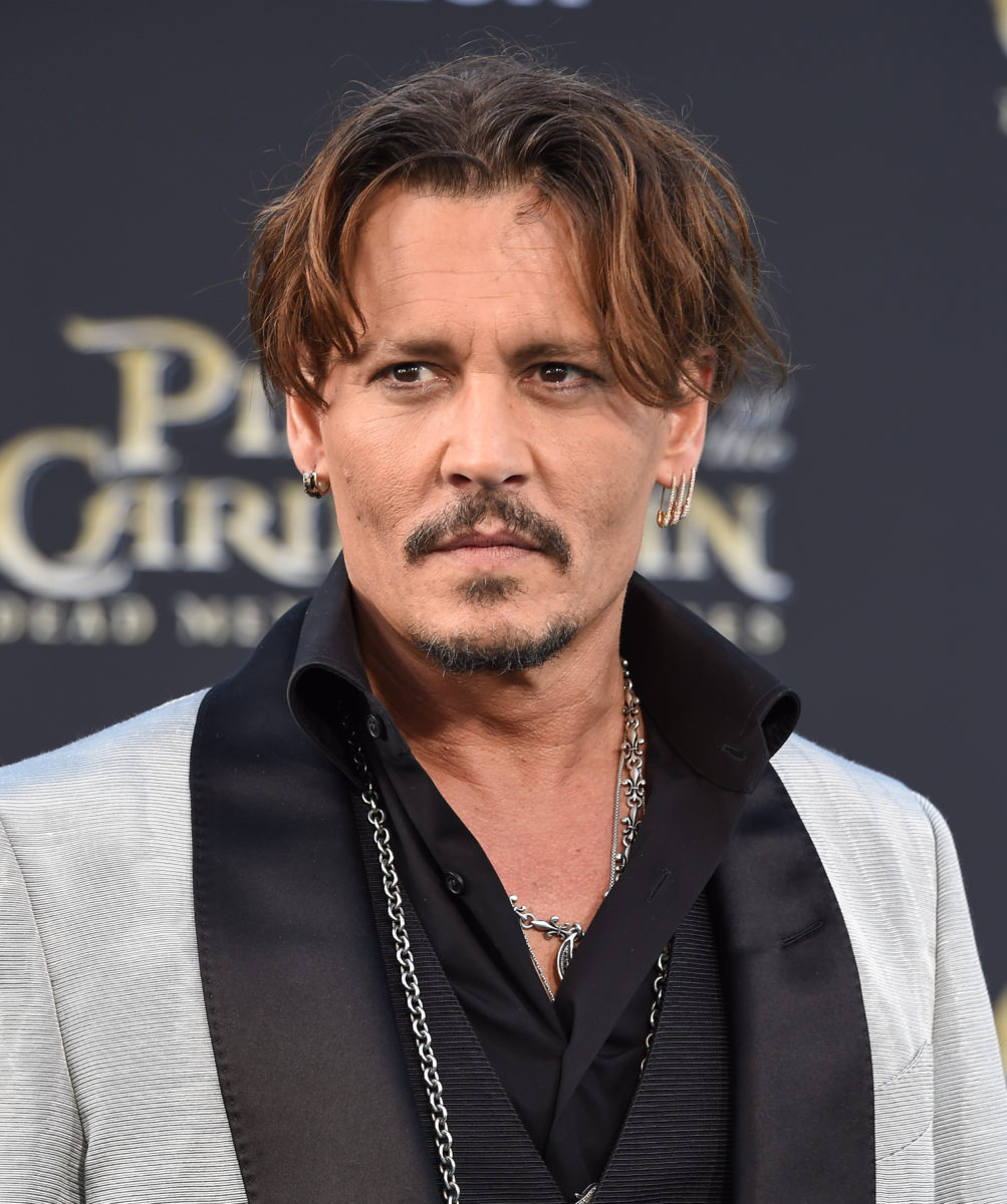 Johnny Depp First Pumps, Cheers, and Gives Parenting Advice While In The UK Over Defamation Verdict | Johnny Depp is celebrating his recent win.