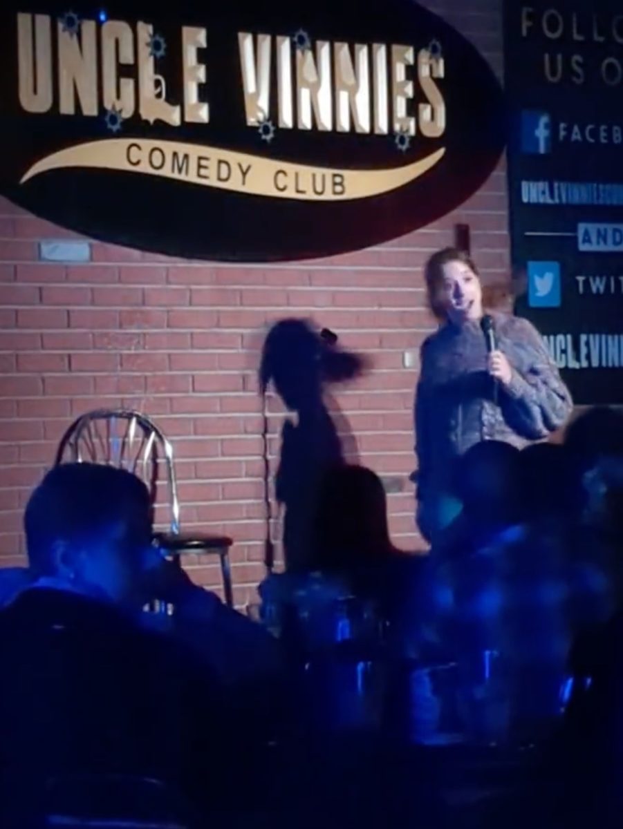video catches a comedian being heckled then having a full beer being chucked at her head