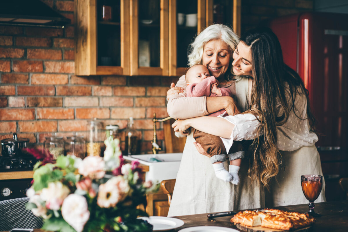 mother grandmother holding baby