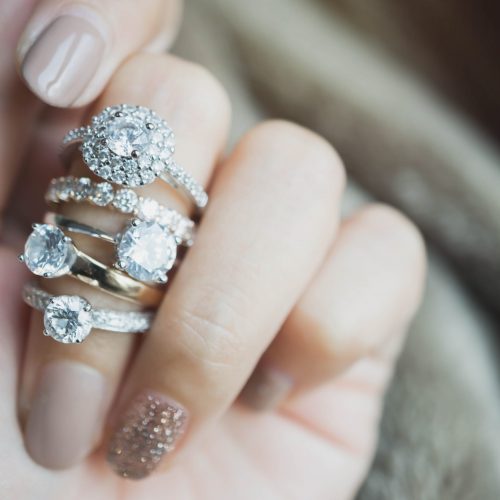 Close,Up,Of,An,Elegant,Diamond,Rings,On,Woman,Finger.love